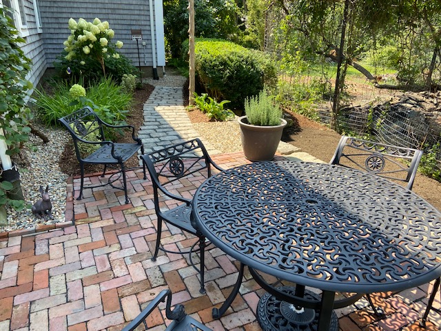 Brick patio with beautiful shrubbery